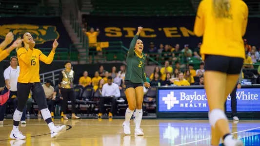 Lauren Briseño celebrates an ace over TCU.