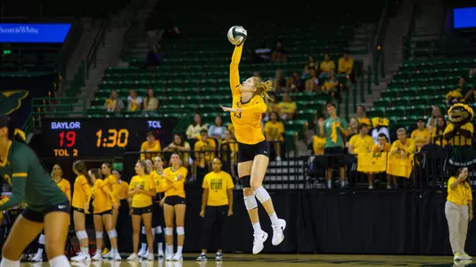 Riley Simpson serves the ball to TCU.