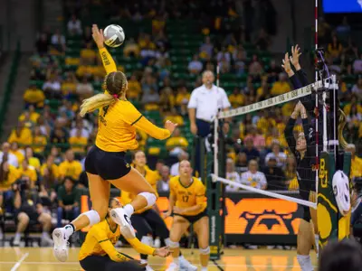 Allie Sczech spikes the ball against TCU.