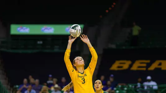 Averi Carlson bumps the ball against TCU.