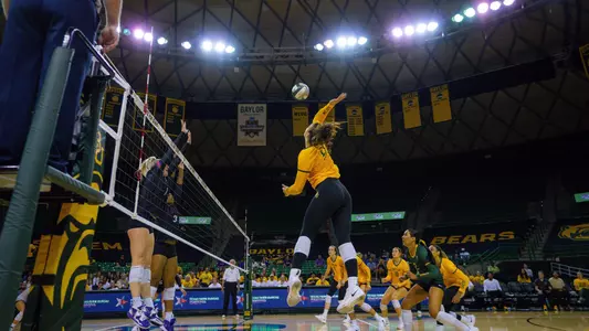 Elise McGhee goes for an attack against TCU.