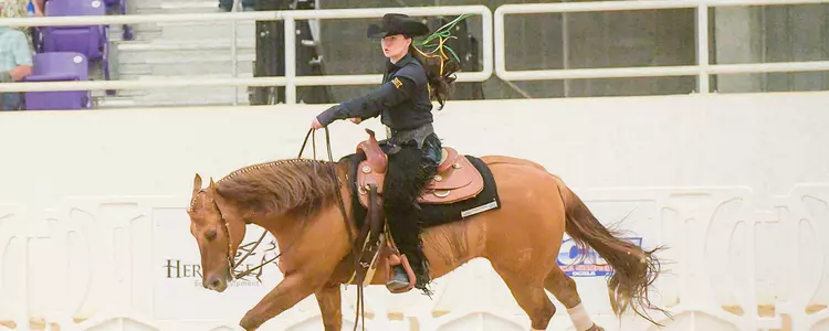 Andie Pratt competes in a Reining ride at the 2022 NCEA Championship