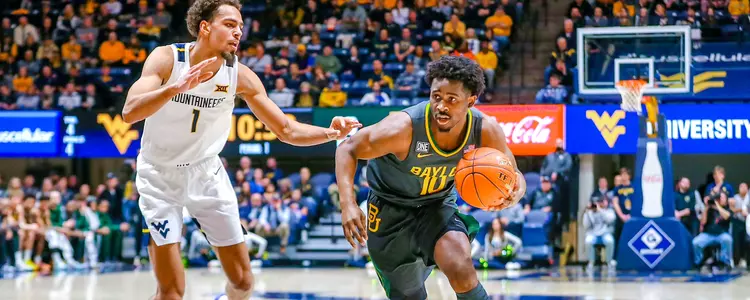Adam Flagler dribbles against West Virginia