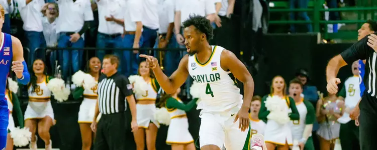 LJ Cryer points to his team after a 3-pointer against Kansas