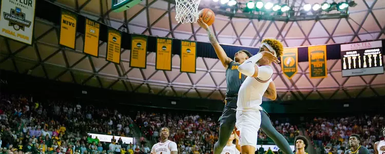 Keyonte George goes for a layup against Arkansas