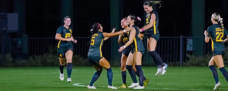 Team celebration after goal against Iowa State