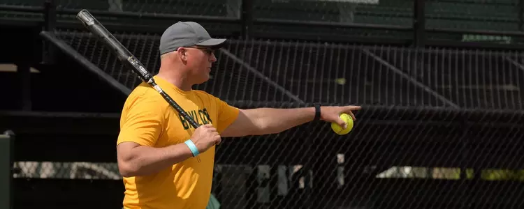 Glenn Moore hits to his players