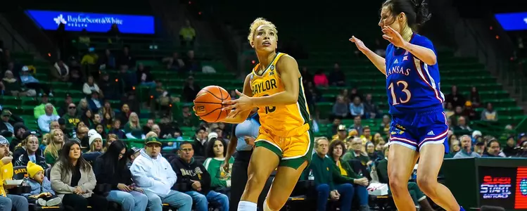 Jaden Owens goes for the layup against KU