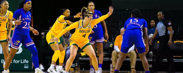 Jana van Gytenbeek defends against Kansas
