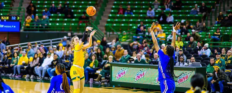 Caitlyn Bickle shoots the three against Kansas