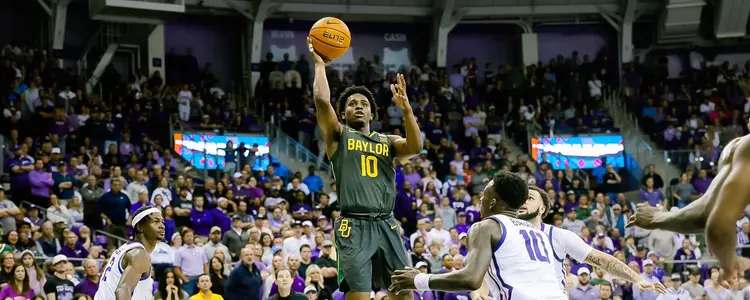 Adam Flagler shoots the three against TCU