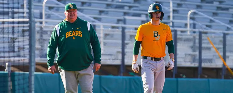 Mitch Thompson and Harrison Caley in a 2023 spring baseball practice