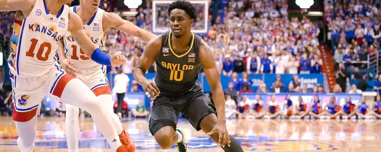 Adam Flagler drives against Kansas