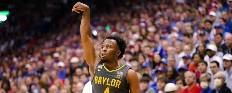 LJ Cryer shoots a three against Kansas