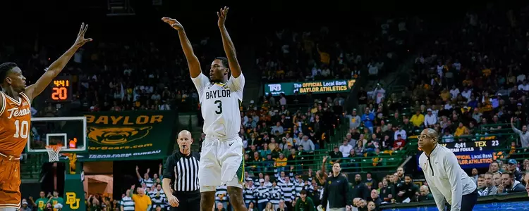 Dale Bonner shoots a 3-pointer against Texas