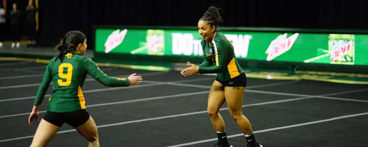 Aliyah Kaloostian celebrates after a tumbling pass against Presbyterian