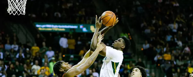 Josh Ojianwuna takes a contested shot against Texas Tech
