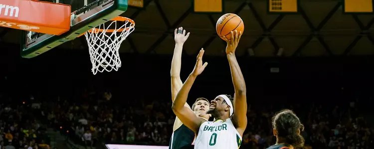 Flo Thamba goes for the layup against Texas Tech