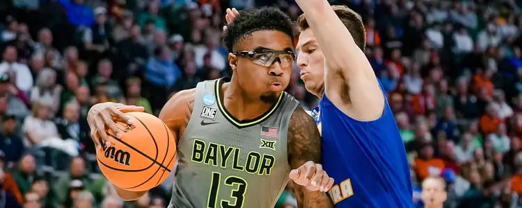 Langston Love maneuvers through defense against UCSB in Round One of the NCAA Tournament