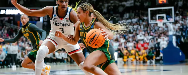 Jaden Owens pushes through the defense against UConn in the Second Round of the NCAA Tournament