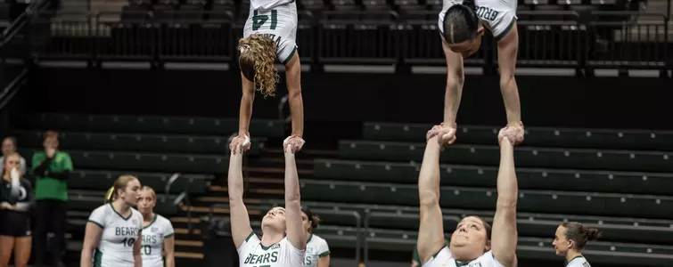 Adelaide Vezzosi competes an inverted handstand on base Ellie LaNeve