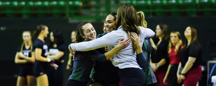 Tumbling quad hugs coach after successful pass