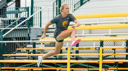 Audrey Williamson hurdling in practice