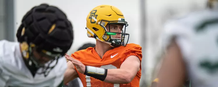 Sawyer Robertson throws pass during spring practice