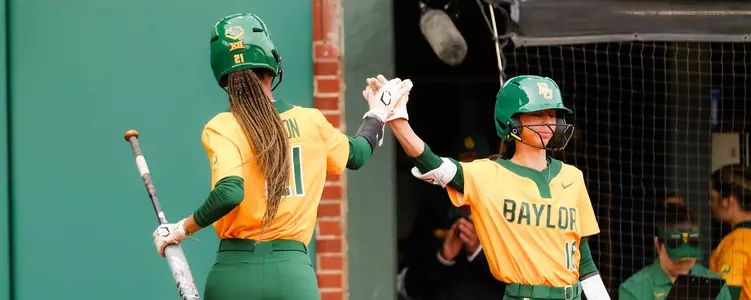 McKenzie Wilson and Presleigh Pilon high-five against UTSA
