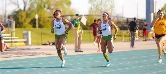 Michaela Francois and Bria Bullard running the 100 meters at the Clyde Hart Classic in Waco