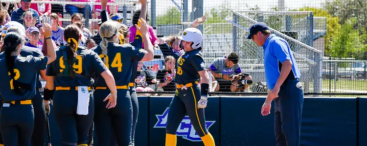Amber Toven celebrates after hitting a home run at ACU