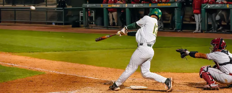 Kolby Branch drives in a run against Oklahoma in 2023