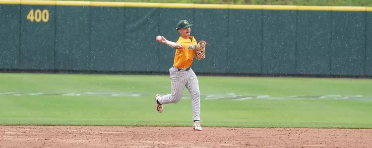 Kolby Branch fields a ground ball in the rain at TCU 2023