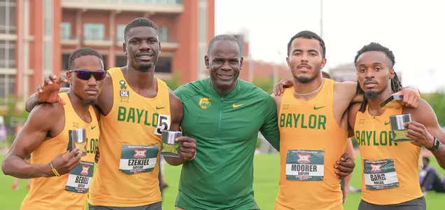 Coach Ford and 4x400 after Big 12 Win