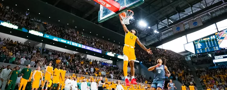 Langston Love gets the dunk on a fast break against TCU