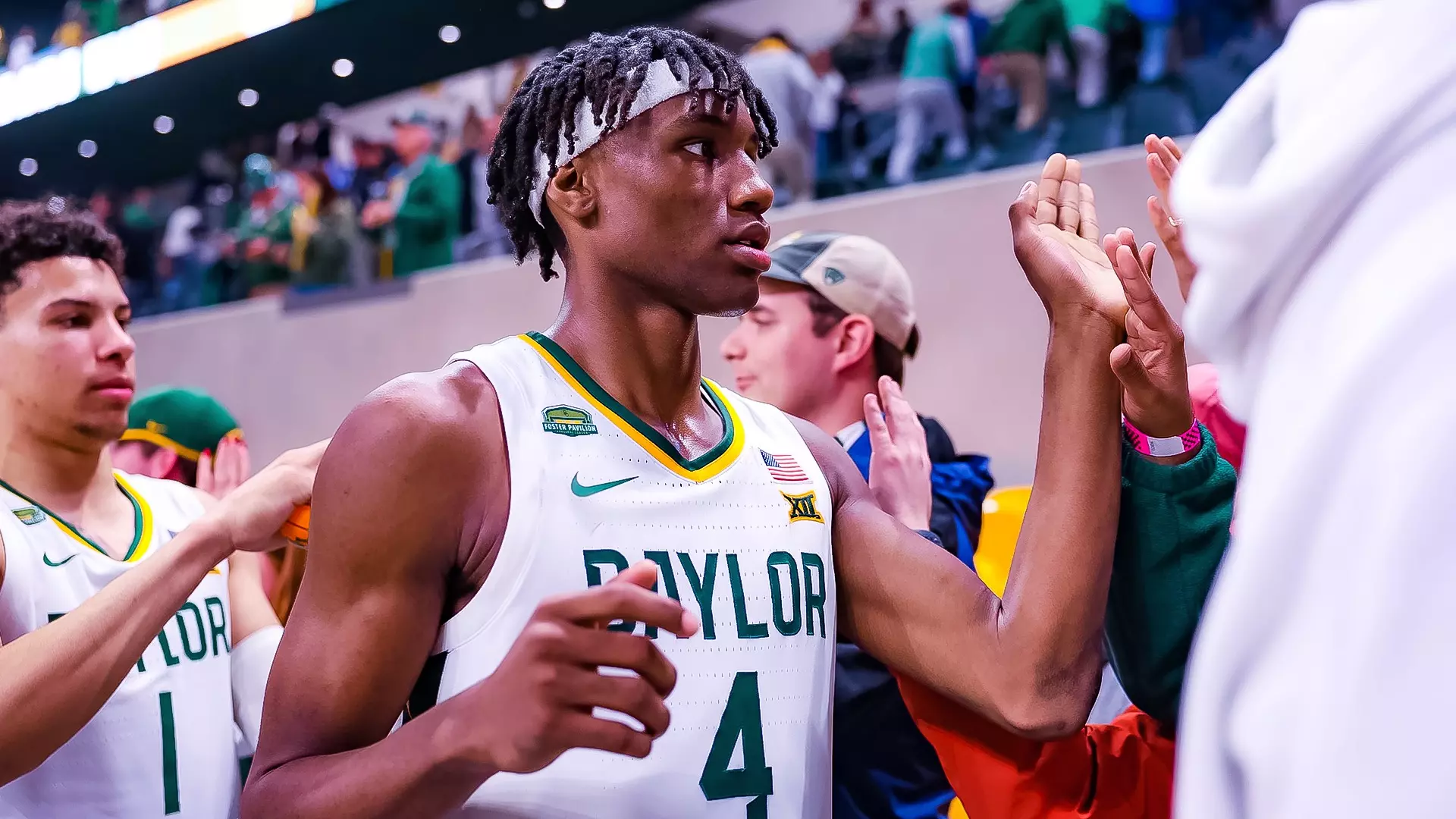 Inaugural Game - Ja'Kobe Walter greets the student section