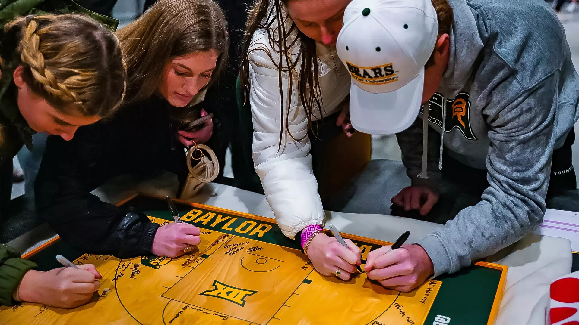 Inaugural Game - Students sign replica court