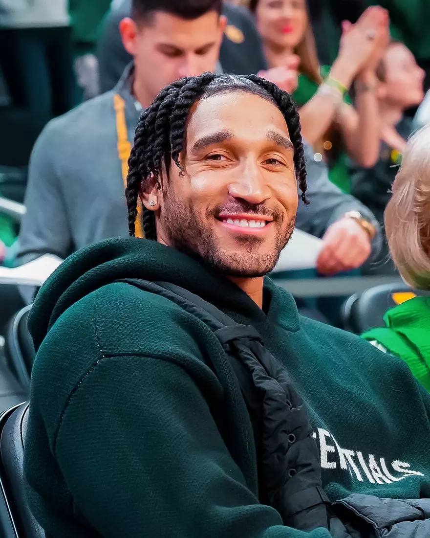 Inaugural Game - MBB alumni Ish Wainright takes in the game