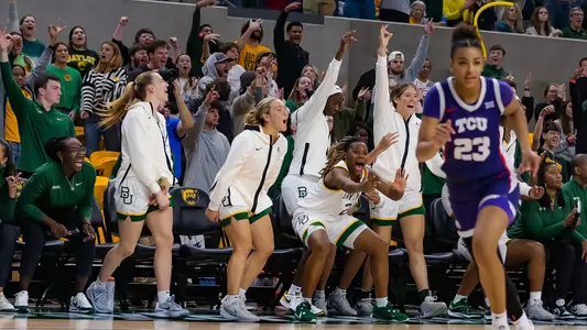 Inaugural game - Bench celebrates a three-pointer