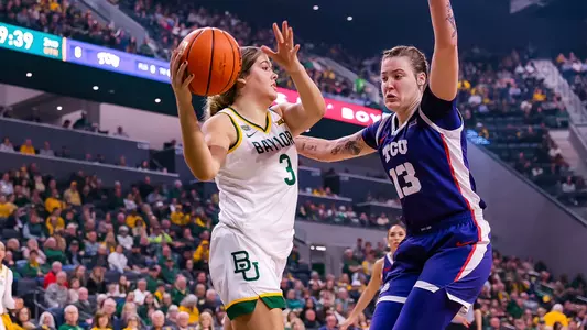 Inaugural game - Madison Bartley looks for an open player