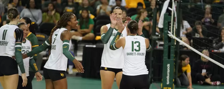 Jackie Barrett Frazier, Victoria Davis and Elise McGhee celebrate against Iowa State