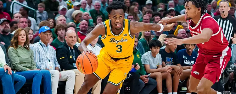 Jeremy Roach dribbles past a defender 2024-25