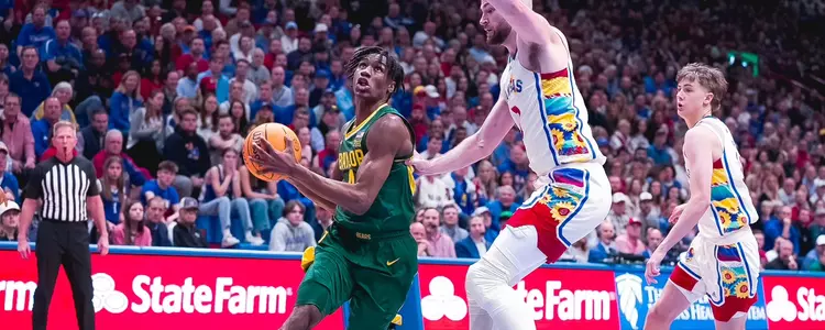 Ja'Kobe Walter drives against Kansas in Lawrence 2024