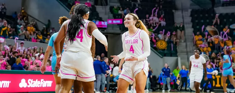 Jana Van Gytenbeek celebrates against Kansas