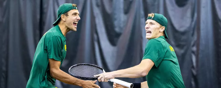Oskar and Chris celebrating in doubles vs No. 5 USC