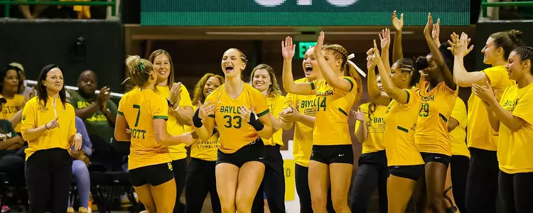Emily Bott is celebrated by her teammates after her tumbling pass