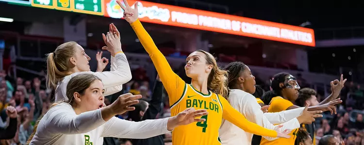 Jana Van Gytenbeek, Denae Fritz and Madison Bartley celebrate against Cincinnati