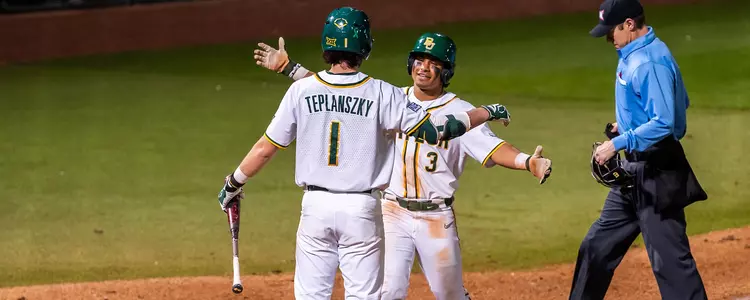 Enzo Apodaca and Hunter Teplanszky hug after Apodaca hits a home run 2024
