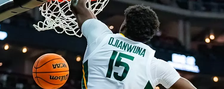 Joshua Ojianwuna dunks against Cincinnati in the Big 12 Quarterfinals