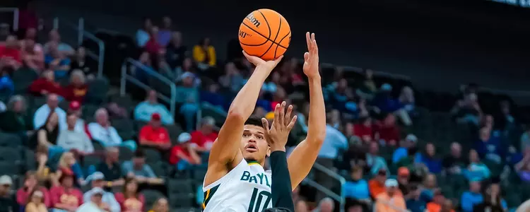 RayJ Dennis shoots against Cincinnati in Big 12 Quarterfinal